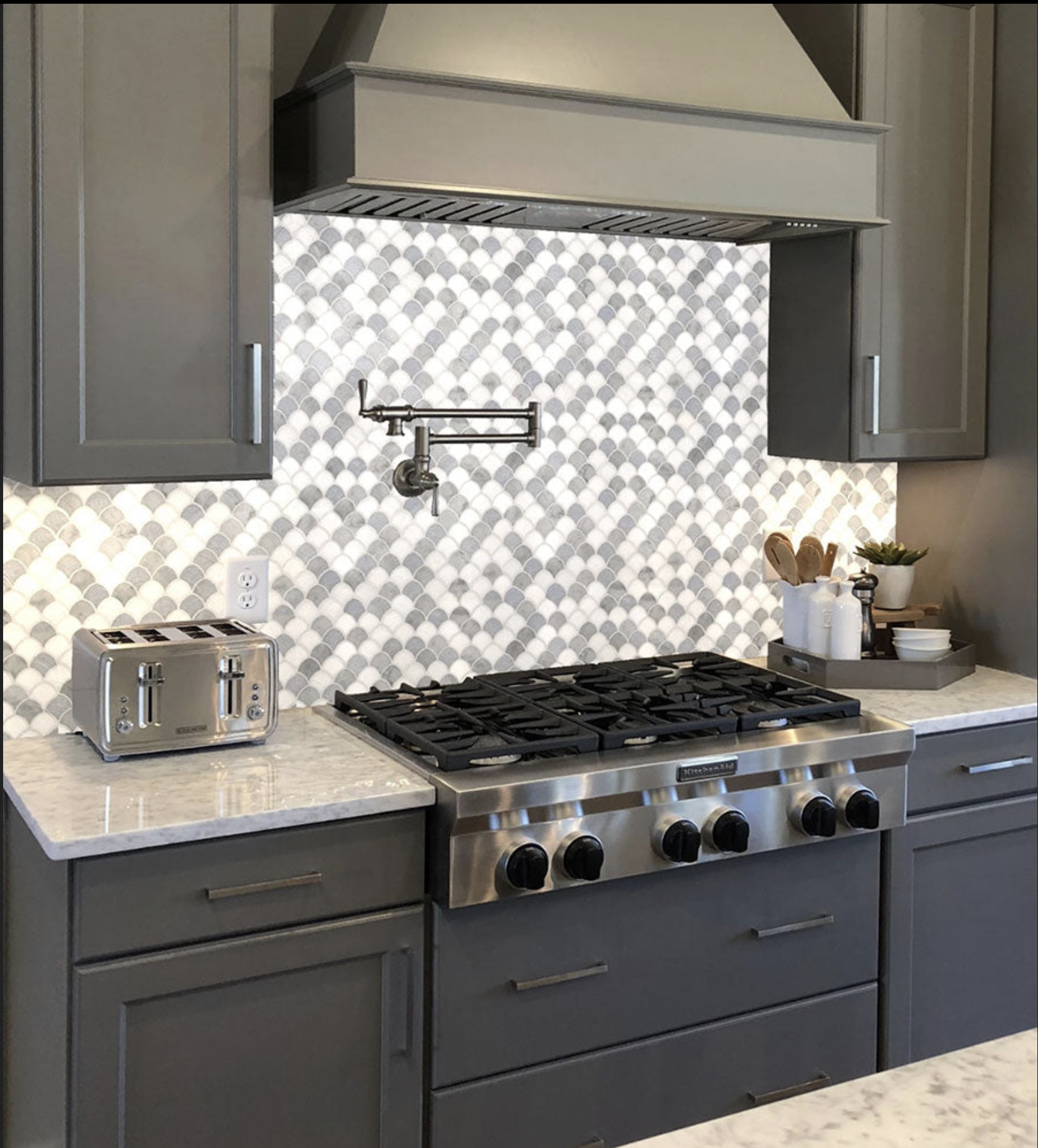 gray and white fish scale kitchen back splash